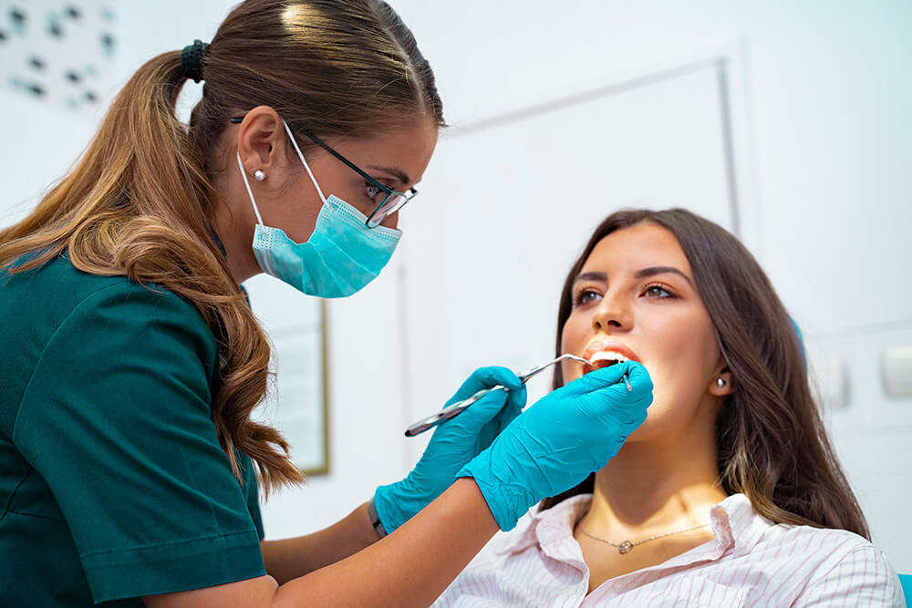 A woman receiving a regular dental checkup at office