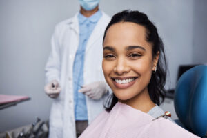 Woman smiling after having her teeth whitened professionally